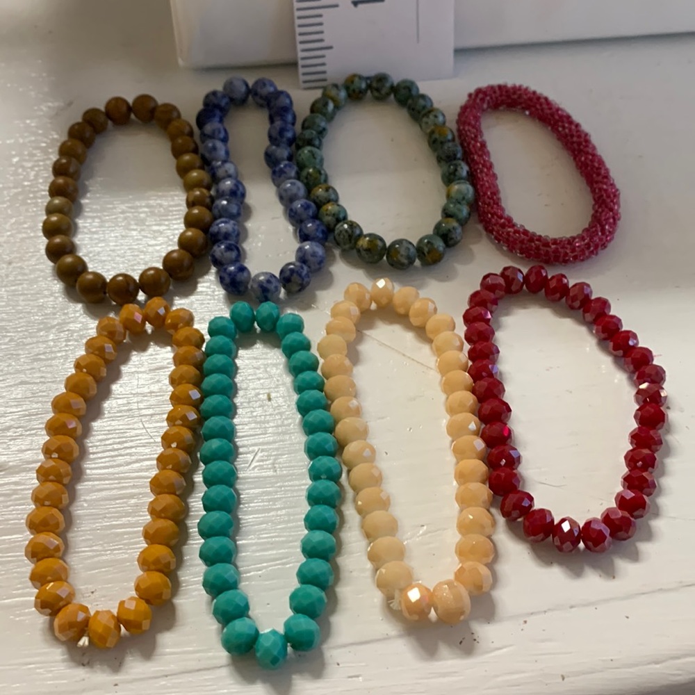 Set of 8 bead bracelets.